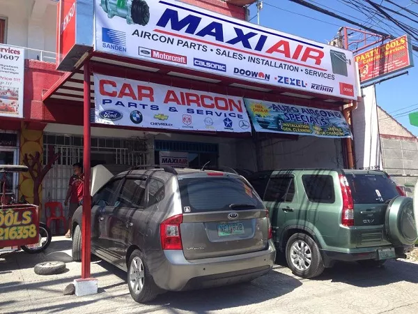 The Maxi Air Car Aircon shop working on some BMWs A picture of the Max Air Car Aircon shop.