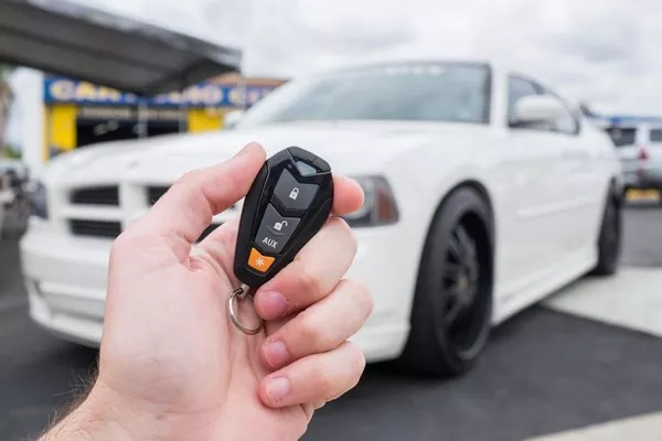 Man holding a key fob