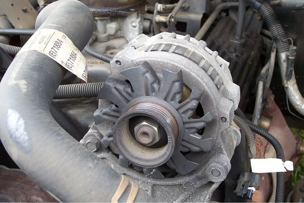 A picture of a car's alternator.