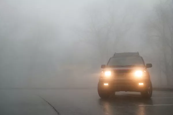 Car and foggy weather