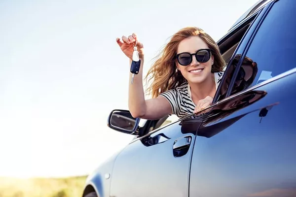 girl in car smiling