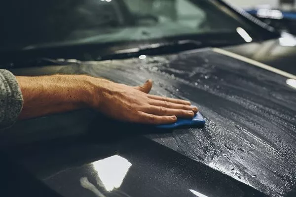 If you're really not sure of what you're doing, then bite bullet and go to a professional A guy applying car clay