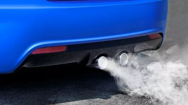 Blue car emitting white smoke