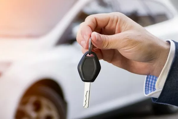 Man holding a car key