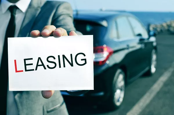 Man holding a leasing sign