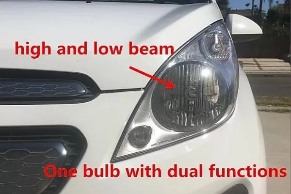 A picture of a car's dual beam headlights.