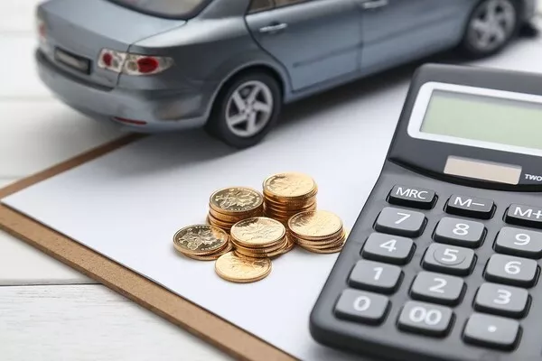 Car, calculator and coins