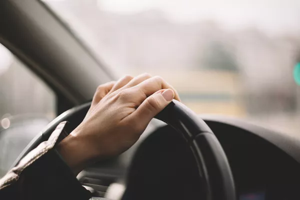 Man holding the steering wheel