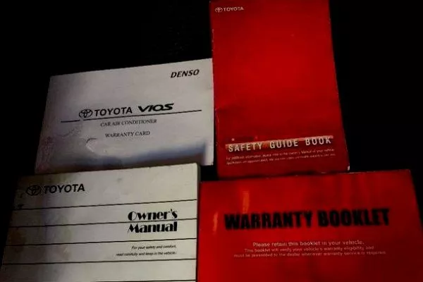 A picture of a TOyota Vios' user's guide and warranty booklet