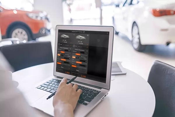 If you’re into buying used cars, do researching and identifying car models that have good reliability records Man researching