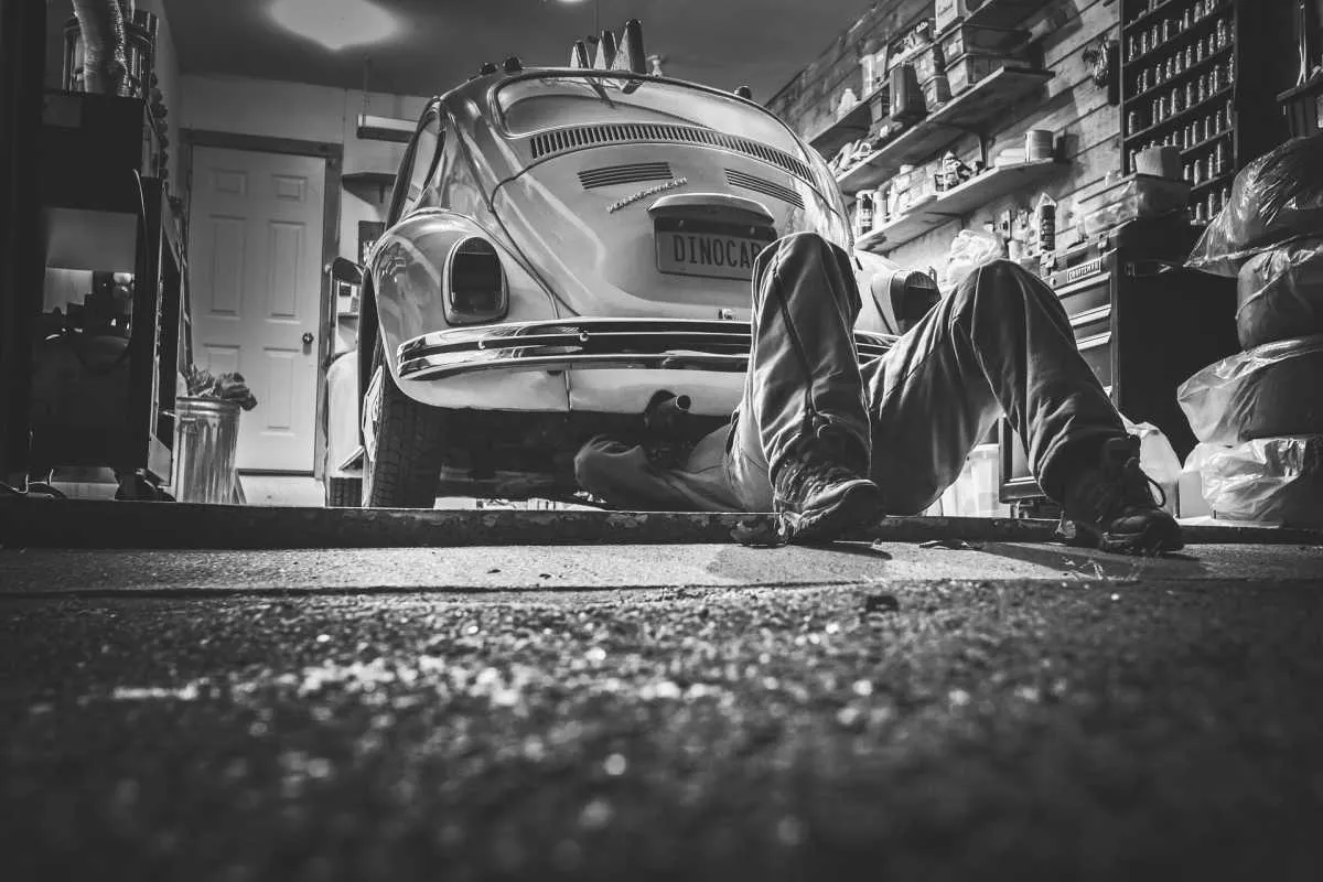 Guy fixing car