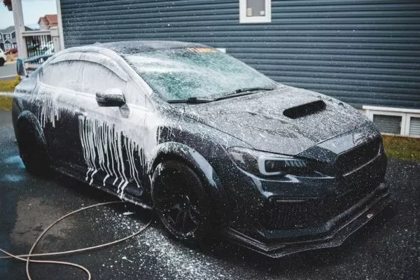 A black car getting washed