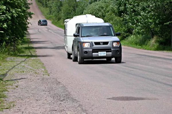 car with cargo going uphill
