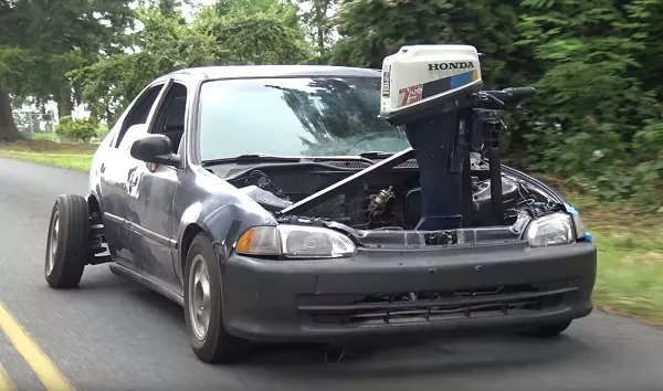 This mod looks really sketchy. It still runs, but slowly A picture of a 4th gen Honda Civic with an outboard engine