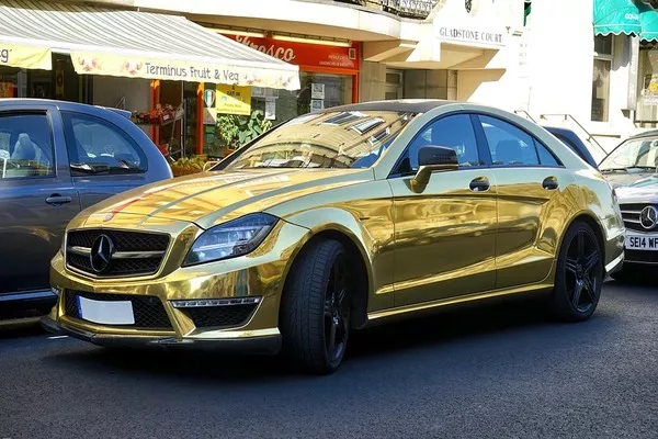 Car wrapped with a gold car wrapping material