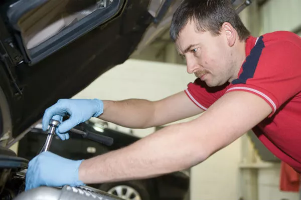 Car mechanic fixing a car