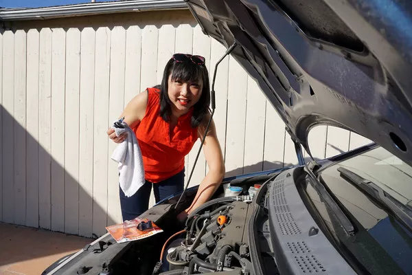Woman checking the engine