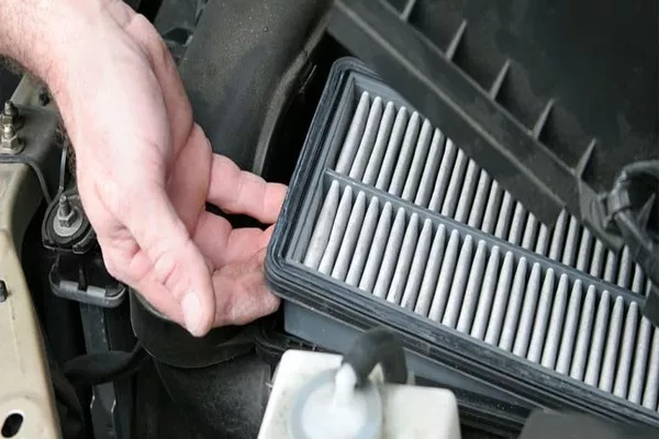 Man removing the air filter