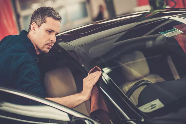 Man checking the car exterior