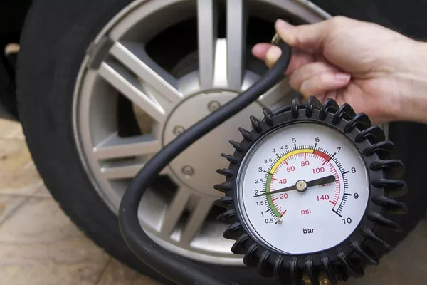 Gauge to check car tire pressure