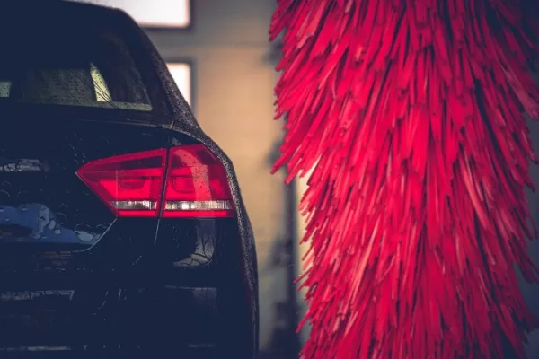 Frequent visit to the car wash can damage your car due to high water pressure Car in a car wash