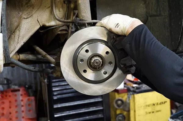 A mechanic fixing a car