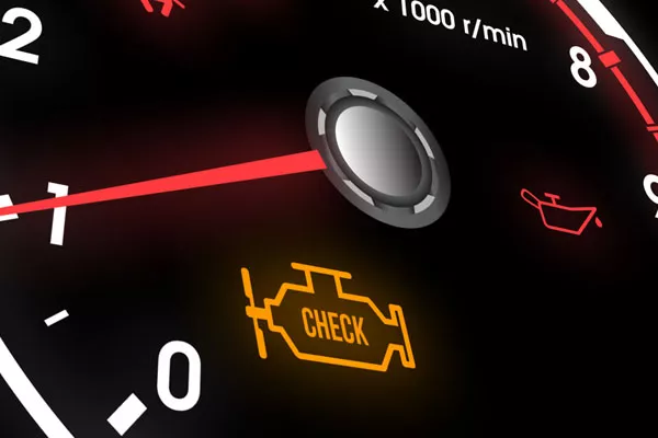 A photo of a lit up check engine warning sign
