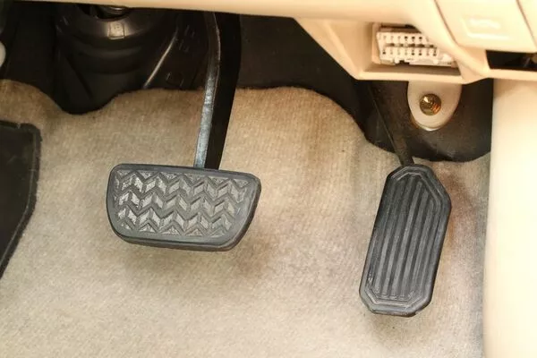 gas and brake pedal of the car