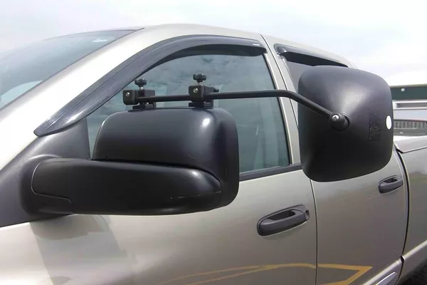Driving a tow vehicle or truck requires the use of extended side-view mirrors. 