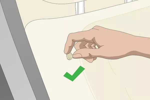 Man putting the fibers in the car seat hole