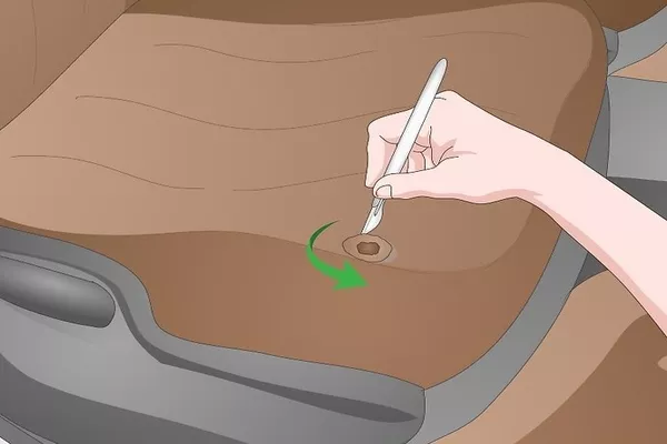 man cutting the leather seat