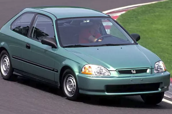 The 90s Honda Civic is an old but surprisingly very fuel efficient car A picture of a green Honda Civic