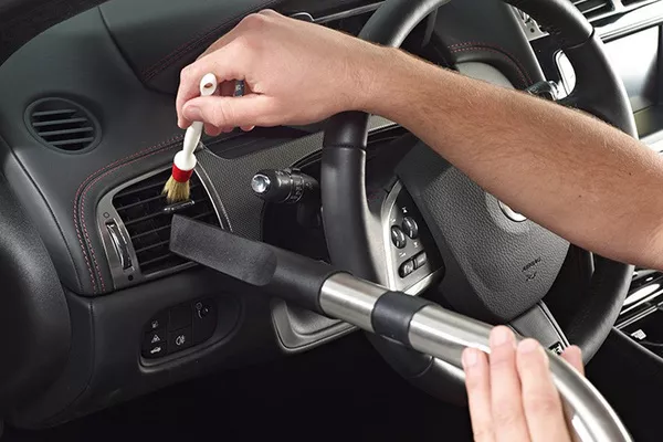 To clean your vehicle’s air conditioner vents, knobs and buttons, use a vacuum cleaner and brush duster Cleaning AC vents