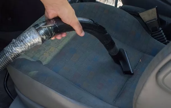 vacuuming car seat