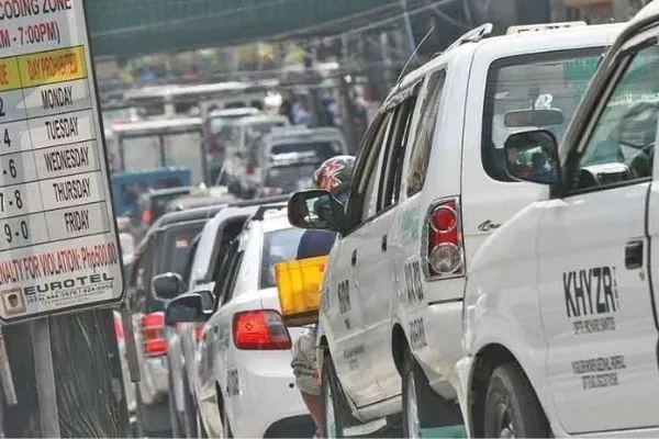 Do you think the coding scheme still helps? A picture of traffic with a coding scheme sign on the side.