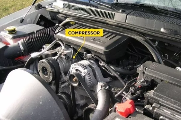 The compressor is a pump that is belt-driven fastened to the engine car compressor