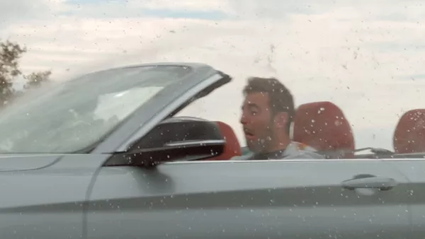 man in a convertible