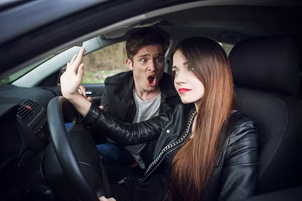 couple arguing in car