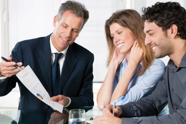 A picture of a couple and a banker