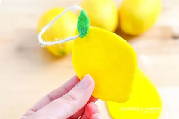 A felt lemon car freshener