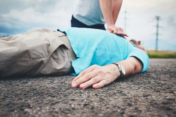 Like when you've stopped your car to administer CPR to a fellow motorist. A rare occurrence but it happens A man giving CPR