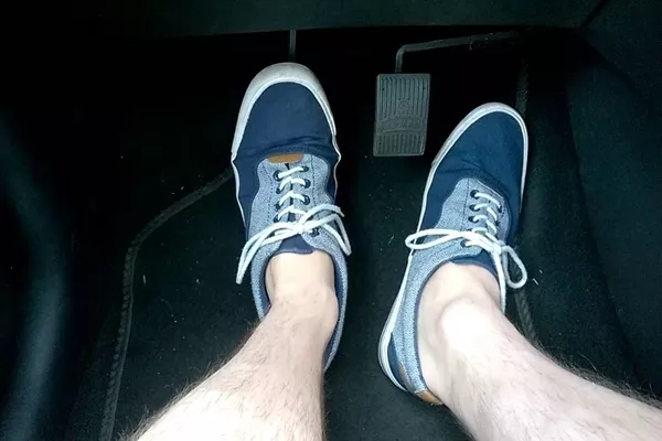 When you’re on cruise control, you don’t need to step on the accelerator. man steeping on the brakes