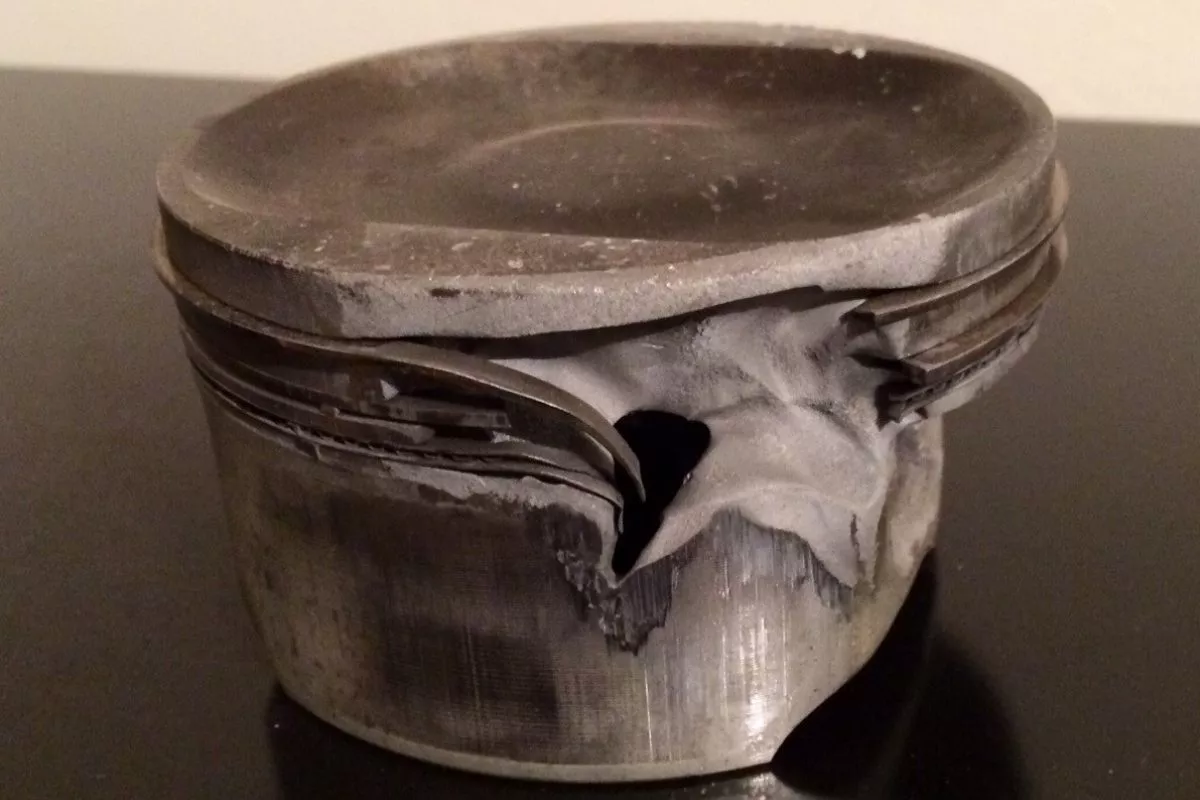 A picture of a damaged piston head