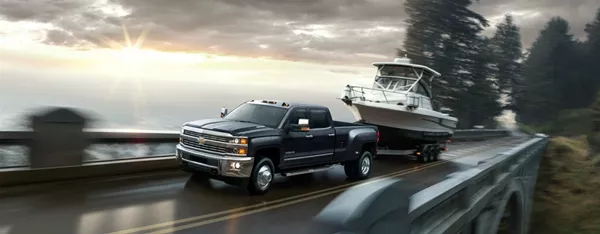 truck is towing a canoe