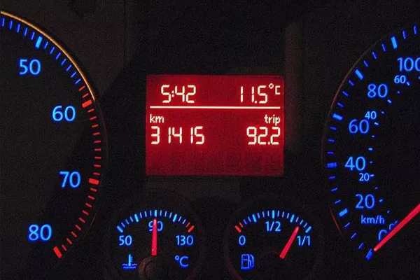 A picture of a digital odometer glowing in the dark
