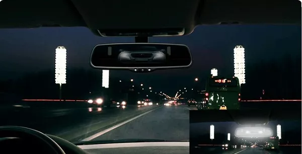 Man driving with auto-dimming rear view mirror