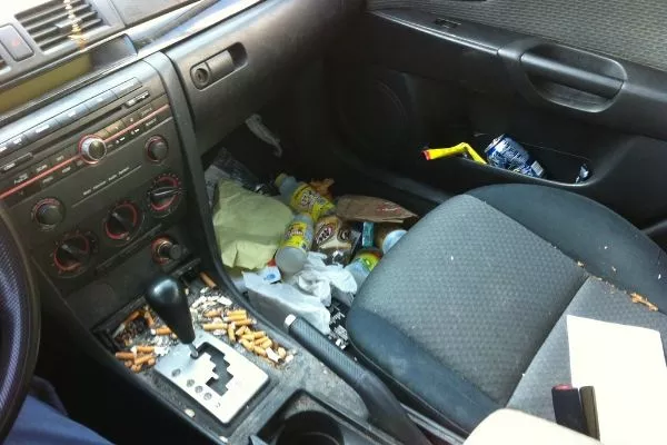 A picture of a very dirty car interior