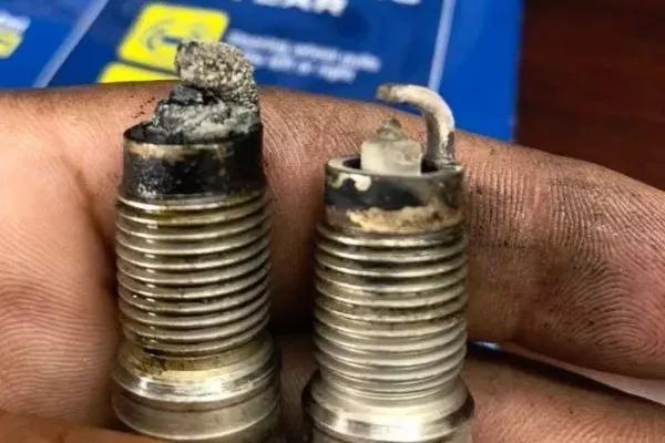 For crying out loud! Don't allow your spark plugs to deteriorate to this condition! A picture of really dirty spark plugs.