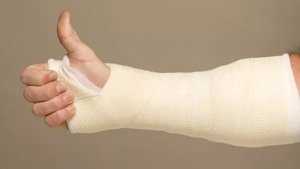 Okay arm wrapped with medical gauge