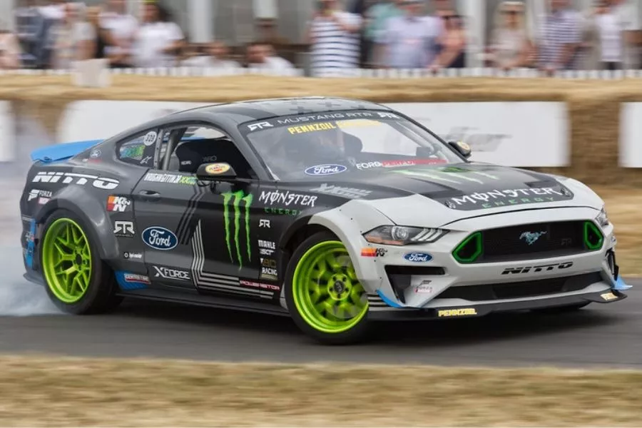 A picture of a Ford Mustang drifting at Goodwood